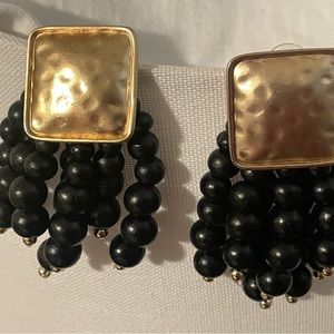 Plunder gold and black beaded drop earrings w/post back.